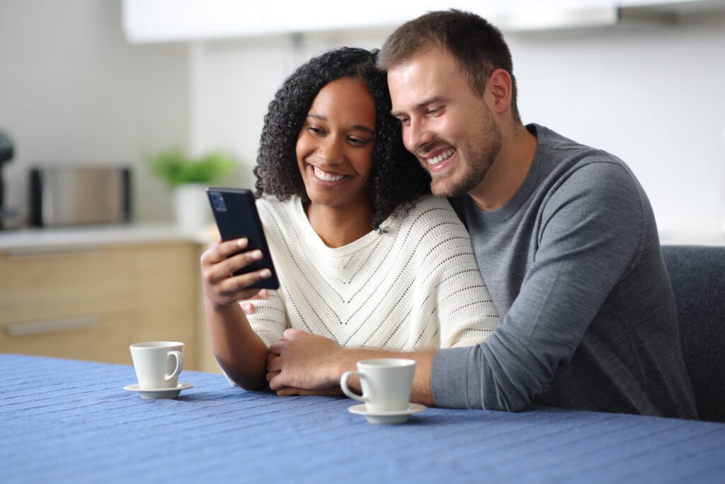a photo of two people (man and woman) sitting together at a table.